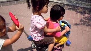 120507 Jameily pushing Harley-Davidson bike