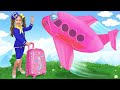 Anita plays with her dad and travels on a huge toy airplane