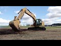 loading up a new cat 320gc excavator