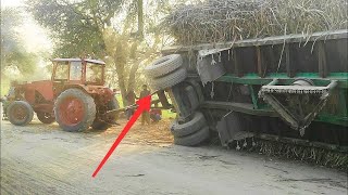 Belarus 510 Tractor & heavily sugarcane loaded trailer overturned