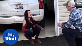 Adorable moment man uses cute Labrador puppy to propose to girlfriend