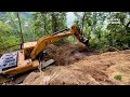 scenic mountain village road construction with hyundai 220ls excavator