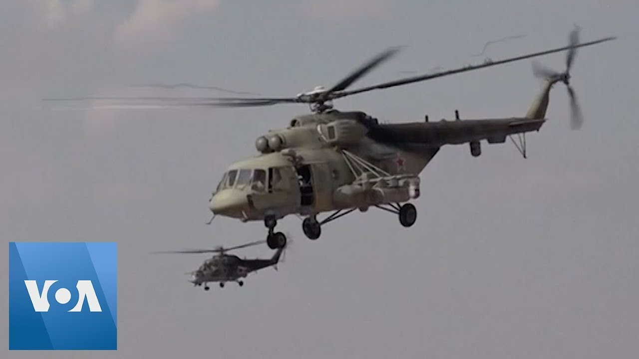 Russian Helicopters Land At Reopened Syrian Airbase - YouTube