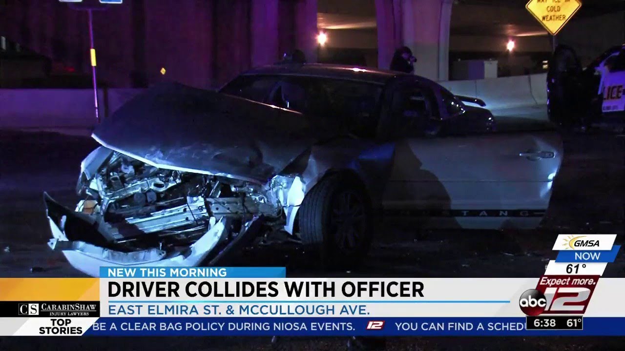 Driver Runs Red Light, Crashes Into Police Cruiser - YouTube