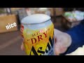 trying new asahi super dry draught beer in a can special lid. remember to remove mask first.