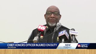 JPD officer honored after being hit by vehicle