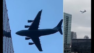 Low-flying plane appears to narrowly miss high-rise buildings - Daily News