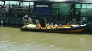 Thames RIB Experience speedboat docked at Tower Millennium Pier in London, UK 5/26/23