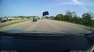 Hood flies off Toyota Camry nearly hitting Jeep