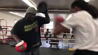 Crisp Punching-Chris Ousley hits the pads with Nate Jones