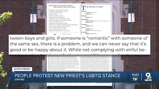 LGBTQ+ protestors appear across from Oxford parish on new priest's first day