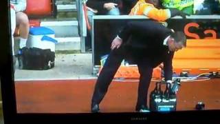 Southampton Manager Nigel Atkins falls over water bottles