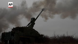 Members of Ukrainian army's Azov Brigade use newly arrived howitzers on frontline