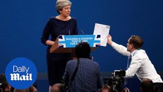 Prankster interrupts May's Tory conference speech to hand her P45 - Daily Mail