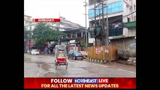 GUWAHATI WAKES UP TO ANOTHER WET DAY. OFFICE GOERS WADE THROUGH WATER LOGGED CITY STREETS