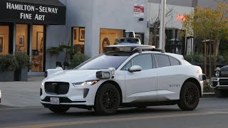 Waymo Driverless Car in Traffic Melrose Avenue Los Angeles California USA January 23, 2025