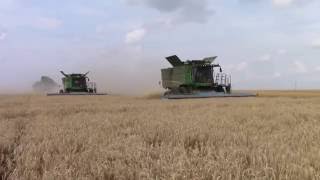 John Deere S670 Combines Harvesting Wheat