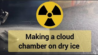 Making a Wilson cloud chamber on dry ice with a heating element.