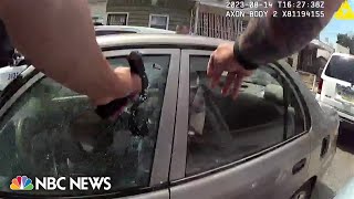 Philadelphia officer charged with murder after bodycam video shows him firing into car