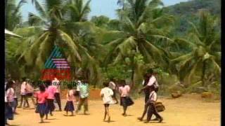 Father carrying his 14 year old handicapped son to school-Kannadi Archives