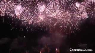 Fireworks illuminate the sky over Paris as France celebrates Bastille Day