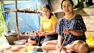 INDA AND WIFE COOKING FISH OUT OF FISHING IN THE RIVER NEAR PONDOK CENTRAL FOREST