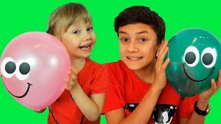 Alena and Pasha plays with balloons in school