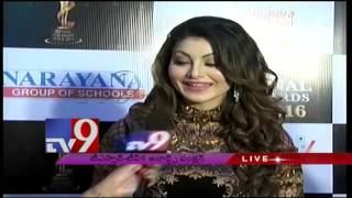 Actress Urvashi Rautela and Nagarjuna on TSR-TV9 National Film Awards function. - TV9