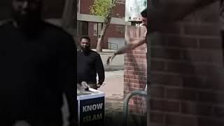 Man desecrates Quran on display at an Islamic information stand in Edmonton, Canada.