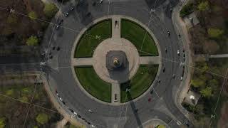 AERIAL: Overhead Birds Eye Drone View Rising over Berlin Victory Column Roundabout with Little Car