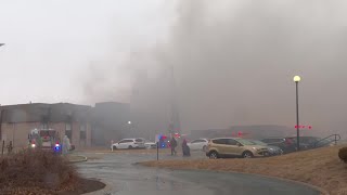 Video shows smoky conditions after strong winds cause fire to spread at Omaha apartment building