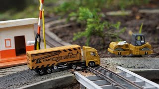Toy Train - Truck Cars Pass The Railroad Tracks