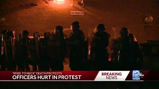 Protesters loot, damage buildings in overnight protest