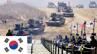 Republic of Korea, US Army. Tanks M1A2 Abrams and M2A3 Bradley cross the river.