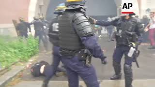 Police use teargas and batons to suppress demonstrators in Paris