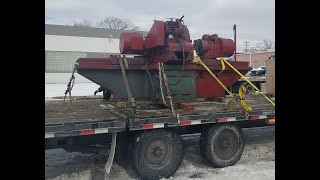 Loading a Berco crankshaft grinder for transport.