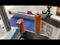 labelling system for two sides application onto boxes with thermal transfer printing unit.