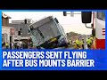 Massive Emergency Response After Bus Mounts Road Barrier Sending Passengers Flying | 10 News First