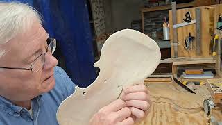 cutting the F holes on the spruce top.