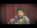 Rita Ora as Post Malone chatting about new music at The KISS Haunted House Party 2018