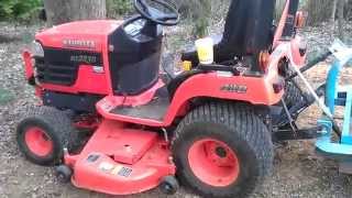 Kubota bx with a dirt / pond scoop