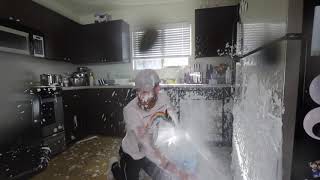 Guy spills "milk" all over his kitchen
