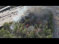 Drone: Flames, and smoke coming from homeless encampment behind Buckhead apartments