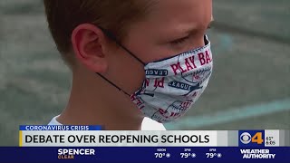 Debate continues over reopening schools