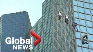 French Spiderman, “Three Musketeers” climb skyscraper