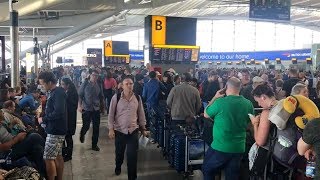 Stranded British Airways passengers slowly make way home after computer outage