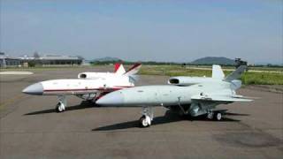 Japanese UAV take off from the wing of F-15J.