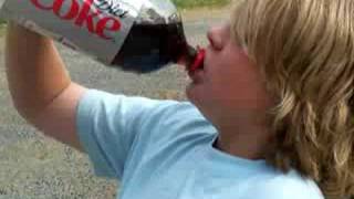 kid drinking the diet coke after mentos