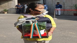 8-year-old Licypriya Kangujam at Haryana assembly showcasing her survival kit to curb air pollution