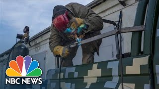 Watch: Volunteers Modify Truck With Armor For Military Use In Lviv, Ukraine